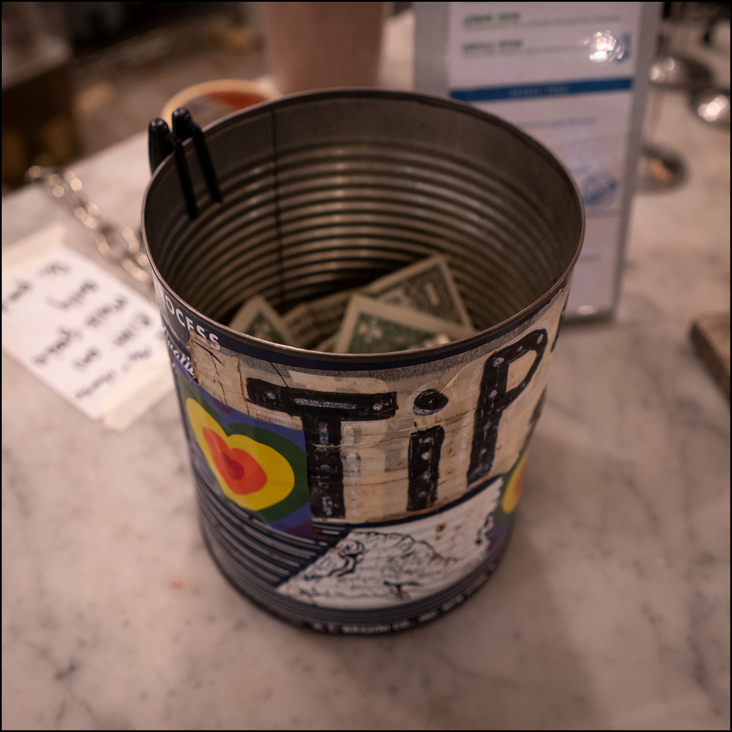 Photo: metal can used for tip jar.
